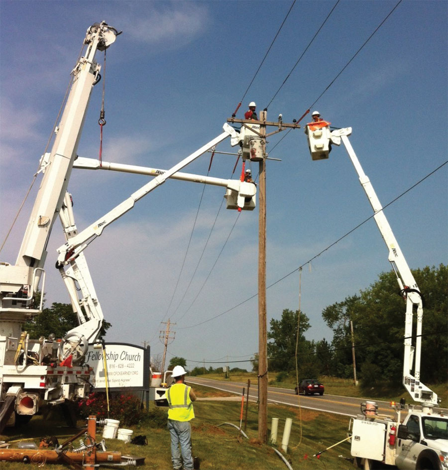 Utility Workers And Vehicles
